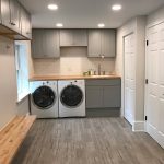 Ott-Construction-Montgomery-County-PA--Wynnewood-Interior-Projects-Custom-laundry-room-radiant-heat-floor-pocket-door-butcher-block-bench-seat-wood-porcelain-floor-white-subway-tile-built-in-sink